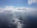 Aerial view. The drone flies over foggy and fluffy clouds. Blue sky sun and sea fog. Abstract aerial nature summer ocean Royalty Free Stock Photo