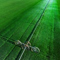 Aerial View from a Drone Flying above Green Farm Field Growing Crops Irrigation Pivot Sprinklers Royalty Free Stock Photo