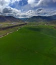 Aerial View from a Drone of a Farm Field of Crops Green Grown with Pivot Sprinklers