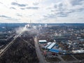 Aerial view from drone of industrial zone with fuming chimneys. Chemical plant