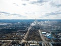 Aerial view from drone of industrial zone with fuming chimneys. Chemical plant