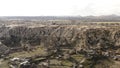 Aerial view from drone of mountains and rocks in Cappadocia near Goreme, Turkey. Action. Beautiful rocky valley with Royalty Free Stock Photo