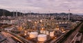Aerial view drone of oil storage tank with oil refinery factory industrial. Oil refinery plant at beautiful sky sunset and Royalty Free Stock Photo