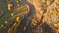 Aerial view from drone over a curve river, fall bald forest and country road Royalty Free Stock Photo