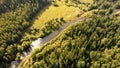 Aerial view from drone over curve river, meadow, forest and ground path Royalty Free Stock Photo