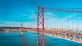 25 De April Bridge. Red bridge in Lisbon, Portugal. Famous sightseeing. Royalty Free Stock Photo