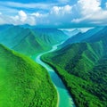 Aerial view drone photo shows a river in Southeast Asia with a lush tropical vegetation and mountains in the