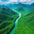 Aerial view drone photo shows a river in Southeast Asia with a lush tropical vegetation and mountains in the