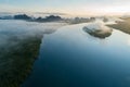 Aerial view drone shot of beautiful ocean against sky in the morning fog mist sunrise drone is flying over sea and mangrove forest Royalty Free Stock Photo