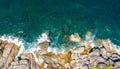 Aerial view drone shot ocean waves, Beautiful tropical beach and rocky coastline and beautiful forest. Nga Khin Nyo Gyee Island