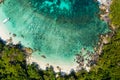 Aerial view drone shot ocean waves, Beautiful tropical beach and rocky coastline and beautiful forest. Nga Khin Nyo Gyee Island