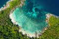 Aerial view drone shot ocean waves, Beautiful tropical beach and rocky coastline and beautiful forest. Nga Khin Nyo Gyee Island