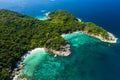 Aerial view drone shot ocean waves, Beautiful tropical beach and rocky coastline and beautiful forest. Nga Khin Nyo Gyee Island