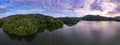 Aerial view drone shot of panorama abundant rainforest Sunset or sunrise sky over lake,Beautiful landscape nature mountains view Royalty Free Stock Photo