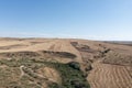 Aerial view with drone summer landscape of field with dry grass with vehicle marking, trees and road. Rural life, free, healthy