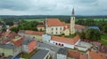 Aerial view from drone to romantic citiscape in Poland, Central Europe. HDR warm filtered photography. Church in the middle