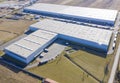 Aerial view from drone of warehouse storage or industrial factory or logistics center. Industrial buildings and equipment machines