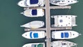 Aerial View by Drone of Yacht Club and Marina. Top view of yacht club. White boats in sea water. Marina dock yachts and Royalty Free Stock Photo
