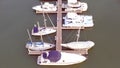 Aerial View by Drone of Yacht Club and Marina. Top view of yacht club. White boats in sea water. Marina dock yachts and