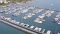 Aerial View by Drone of Yacht Club and Marina. Top view of yacht club. White boats in sea water. Marina dock yachts and Royalty Free Stock Photo