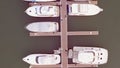 Aerial View by Drone of Yacht Club and Marina. Top view of yacht club. White boats in sea water. Marina dock yachts and Royalty Free Stock Photo