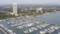 Aerial View by Drone of Yacht Club and Marina. Top view of yacht club. White boats in sea water. Marina dock yachts and Royalty Free Stock Photo