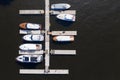 Aerial View by Drone of Yacht Club and Marina. Top view of yacht club. White boats in sea water. Marina dock yachts and small Royalty Free Stock Photo