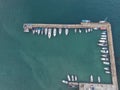 Aerial View by Drone of Yacht Club and Marina. Top view of yacht club. White boats in sea water. Marina dock yachts and Royalty Free Stock Photo