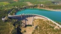 Aerial view of the dry spillway of a concrete dam during a long drought