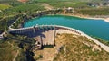 Aerial view of the dry spillway of a concrete dam during a long drought