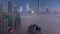 Aerial view of Dubai city early morning during fog night to day timelapse. Royalty Free Stock Photo