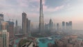 Aerial view of Dubai city early morning during fog night to day timelapse. Royalty Free Stock Photo