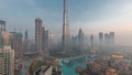 Aerial view of Dubai city early morning during fog night to day timelapse. Royalty Free Stock Photo