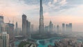 Aerial view of Dubai city early morning during fog night to day timelapse. Royalty Free Stock Photo