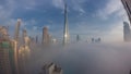 Aerial view of Dubai city early morning during fog night to day timelapse. Royalty Free Stock Photo