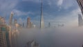 Aerial view of Dubai city early morning during fog night to day timelapse. Royalty Free Stock Photo