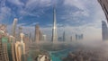 Aerial view of Dubai city early morning during fog night to day timelapse. Royalty Free Stock Photo