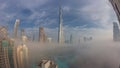 Aerial view of Dubai city early morning during fog night to day timelapse. Royalty Free Stock Photo