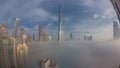 Aerial view of Dubai city early morning during fog night to day timelapse. Royalty Free Stock Photo