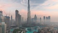 Aerial view of Dubai city early morning during fog night to day timelapse. Royalty Free Stock Photo