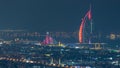 Aerial view of Dubai city skyline at night with illuminated burj al arab hotel timelapse. Royalty Free Stock Photo