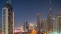 Aerial view of Dubai Downtown skyline with many towers day to night timelapse. Royalty Free Stock Photo