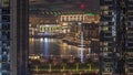 Aerial view of Dubai Fountain in downtown with palms in park next to shopping mall and souq day to night timelapse, UAE Royalty Free Stock Photo