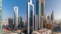 Aerial view of Dubai International Financial District with many skyscrapers all day timelapse. Royalty Free Stock Photo