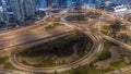 Aerial view on Dubai Marina with big highway intersection night timelapse and skyscrapers around, UAE Royalty Free Stock Photo