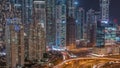 Aerial view on Dubai Marina with big highway intersection night timelapse and skyscrapers around, UAE Royalty Free Stock Photo