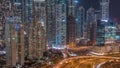 Aerial view on Dubai Marina with big highway intersection night timelapse and skyscrapers around, UAE Royalty Free Stock Photo