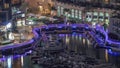 Aerial view on Dubai Marina skyscrapers and the most luxury yacht in harbor night timelapse, Dubai, United Arab Emirates Royalty Free Stock Photo
