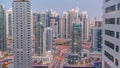 Aerial view on Dubai Marina skyscrapers and the most luxury yacht in harbor day to night timelapse, Dubai, United Arab Royalty Free Stock Photo