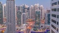 Aerial view on Dubai Marina skyscrapers and the most luxury yacht in harbor day to night timelapse, Dubai, United Arab Royalty Free Stock Photo